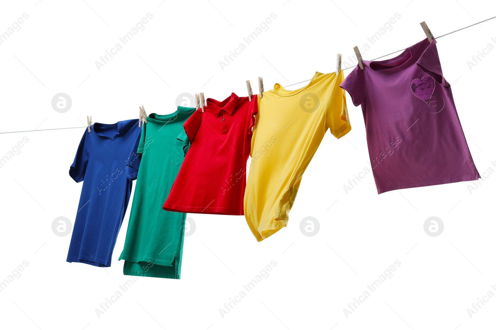 Photo of Colorful t-shirts drying on washing line isolated on white