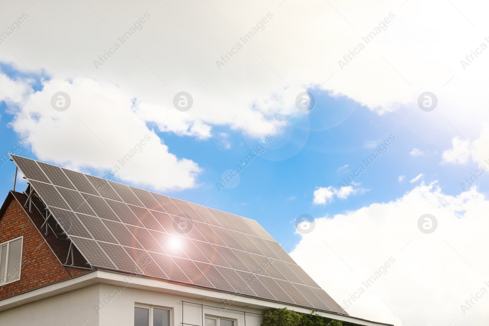 Photo of Building with installed solar panels on roof. Alternative energy source