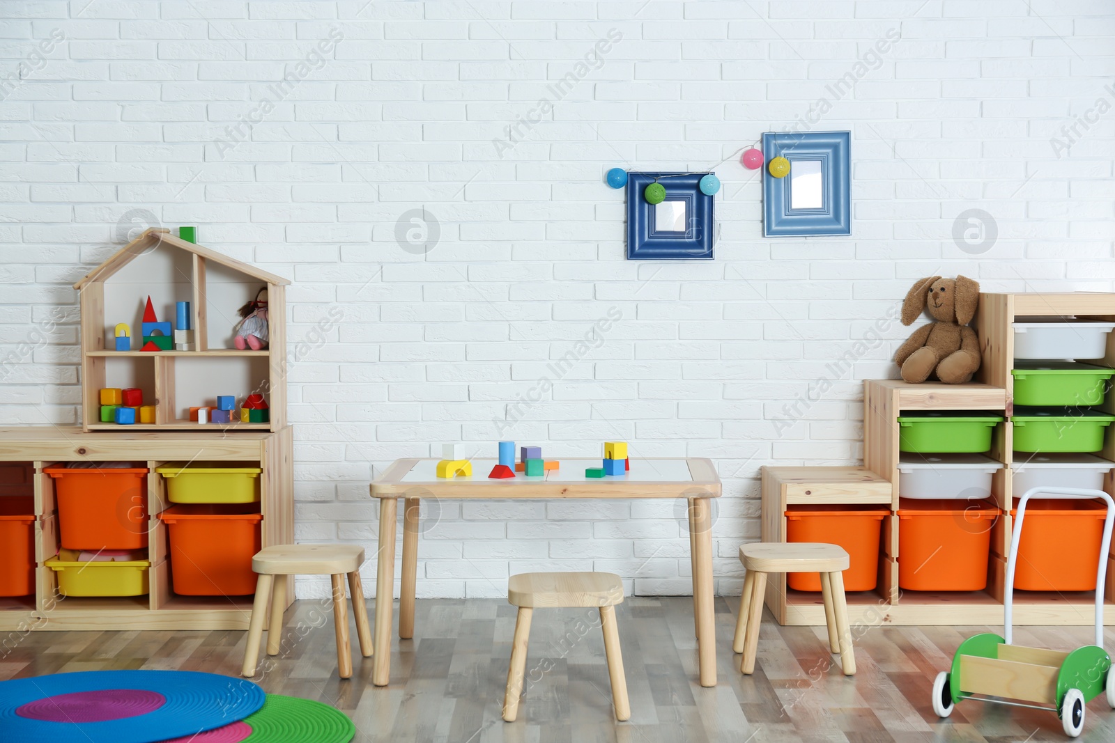 Photo of Modern child room interior with table and stools