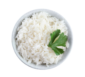 Photo of Bowl with cooked rice and parsley isolated on white, top view