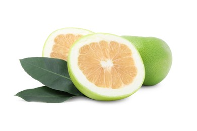 Whole and cut sweetie fruits with green leaves on white background