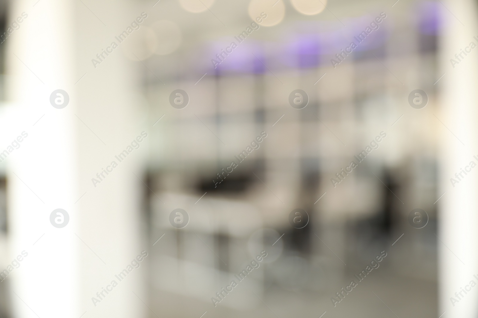 Photo of Blurred view of empty conference room and glass door in office