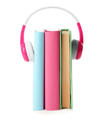 Books and modern headphones isolated on white