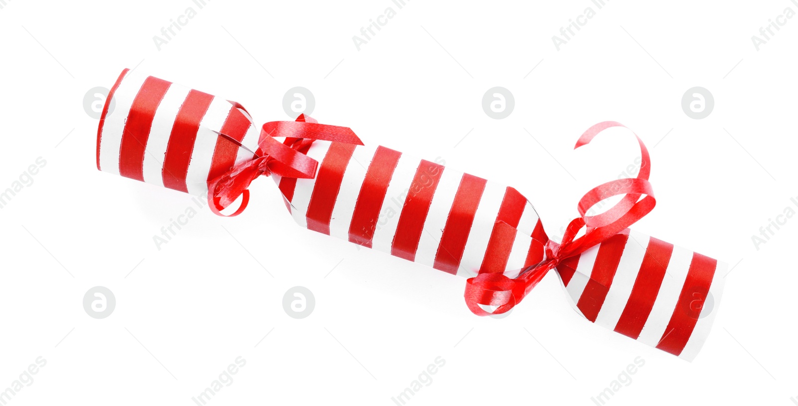 Photo of Bright striped Christmas cracker isolated on white