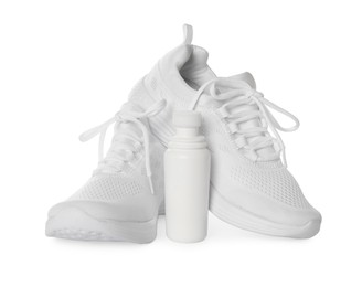 Stylish footwear and shoe care accessory on white background