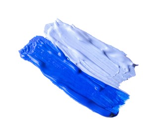 Photo of Samples of blue paint on white background, top view