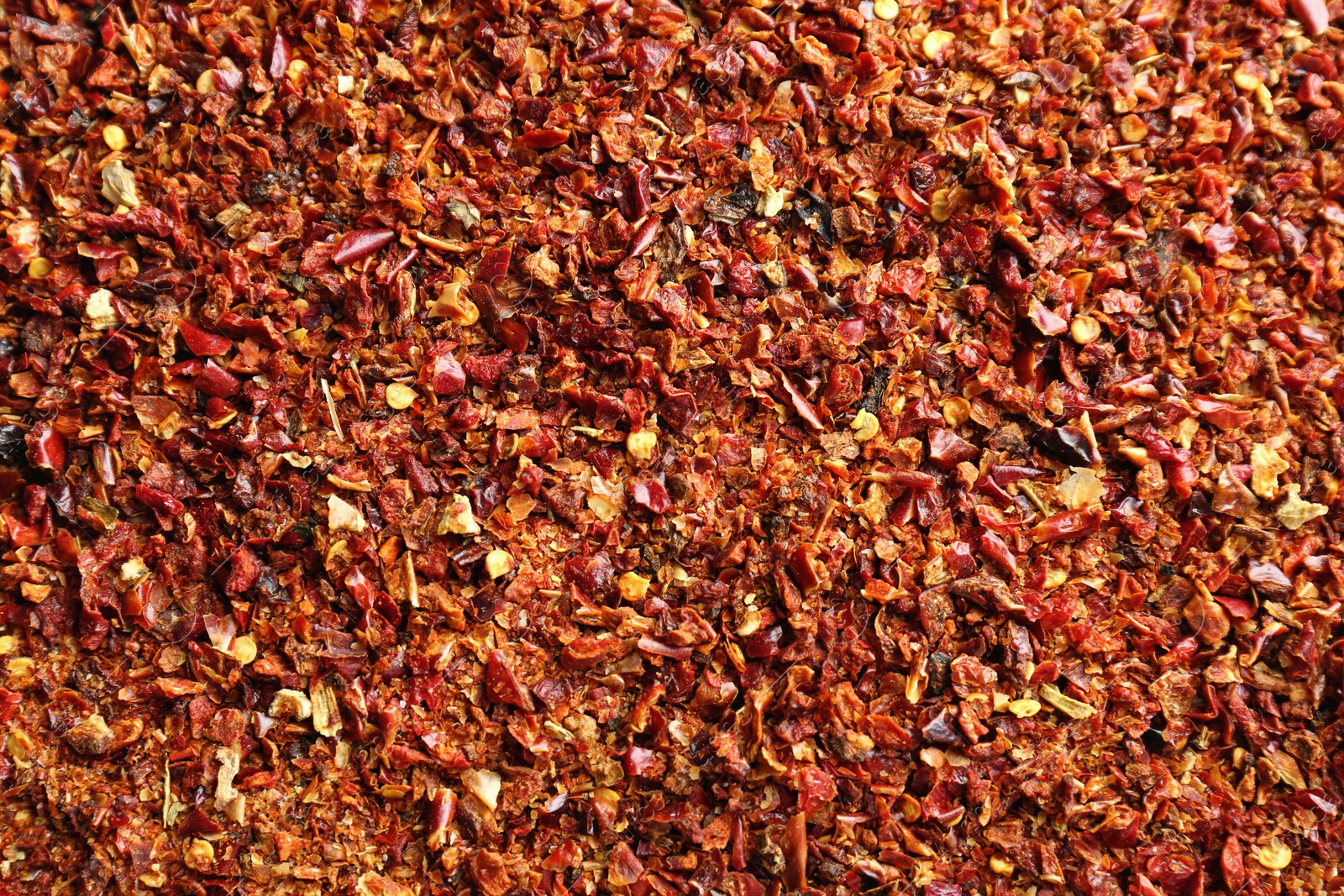 Photo of Crushed chili pepper as background