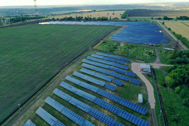 Solar panels installed outdoors, aerial view. Alternative energy source