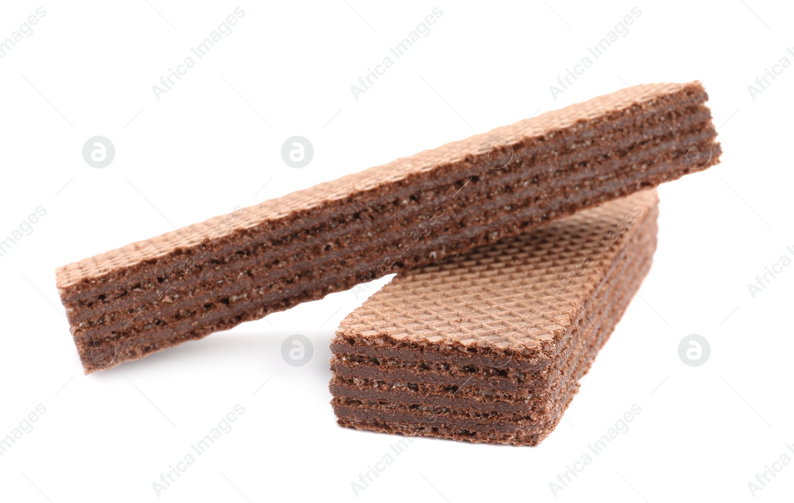 Photo of Delicious crispy wafers on white background. Sweet food