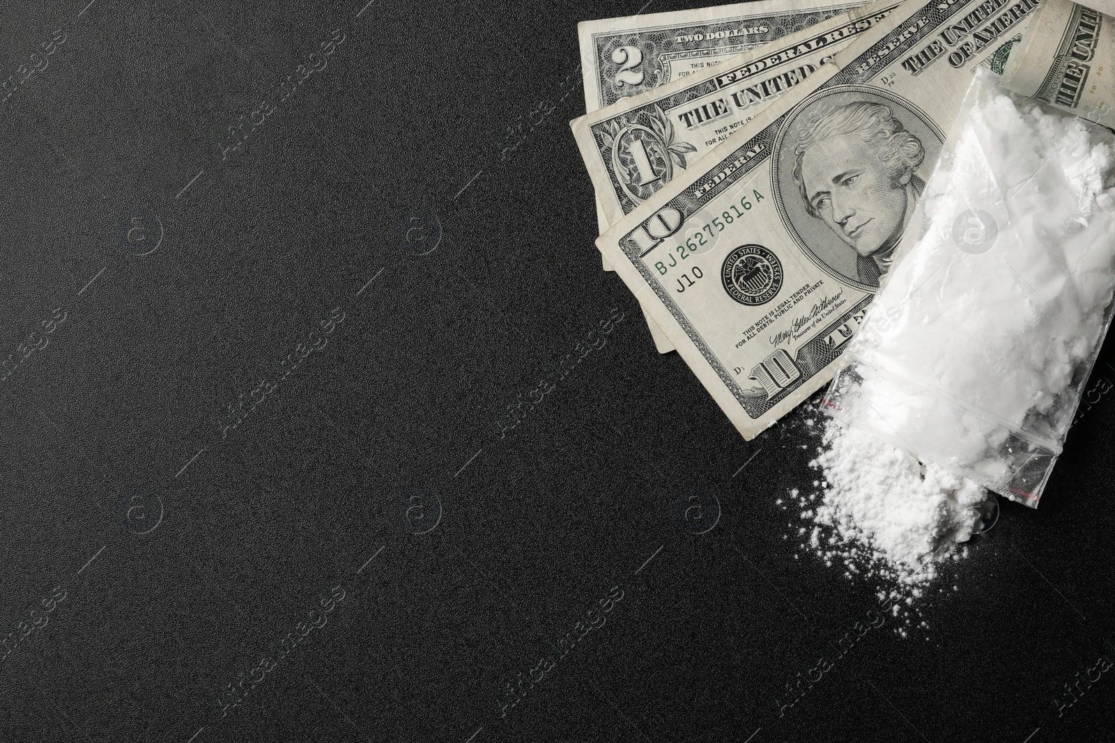 Photo of Flat lay composition with cocaine and money on dark background. Space for text