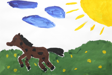 Photo of Child's painting of horse in field on white paper