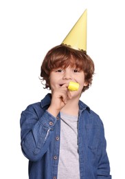 Photo of Birthday celebration. Cute little boy in party hat with blower on white background