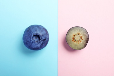 Flat lay composition with tasty blueberry on color background