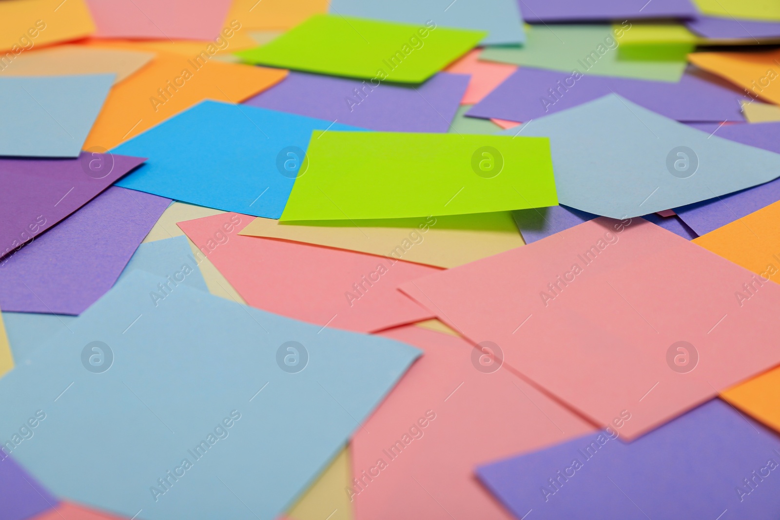 Photo of Many colorful stickers as background, closeup view