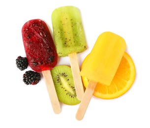 Photo of Delicious ice popsicles and fresh fruits on white background, top view