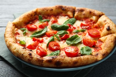 Delicious Margherita pizza on gray table, closeup