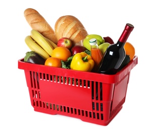 Photo of Shopping basket with grocery products on white background