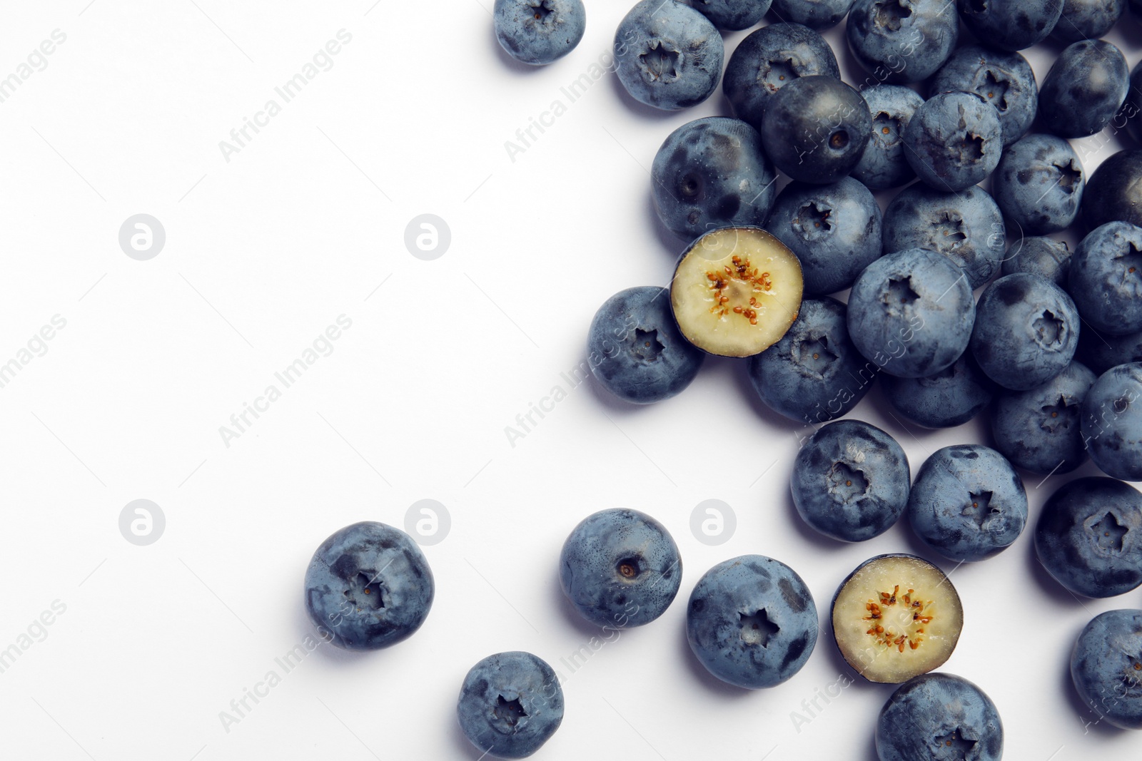 Photo of Flat lay composition with tasty blueberry and space for text on white background