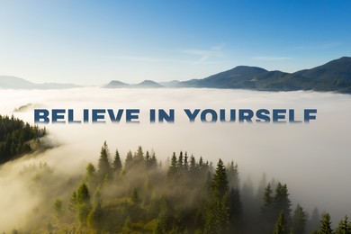 Motivational quote Believe In Yourself. Beautiful view of foggy mountains with text