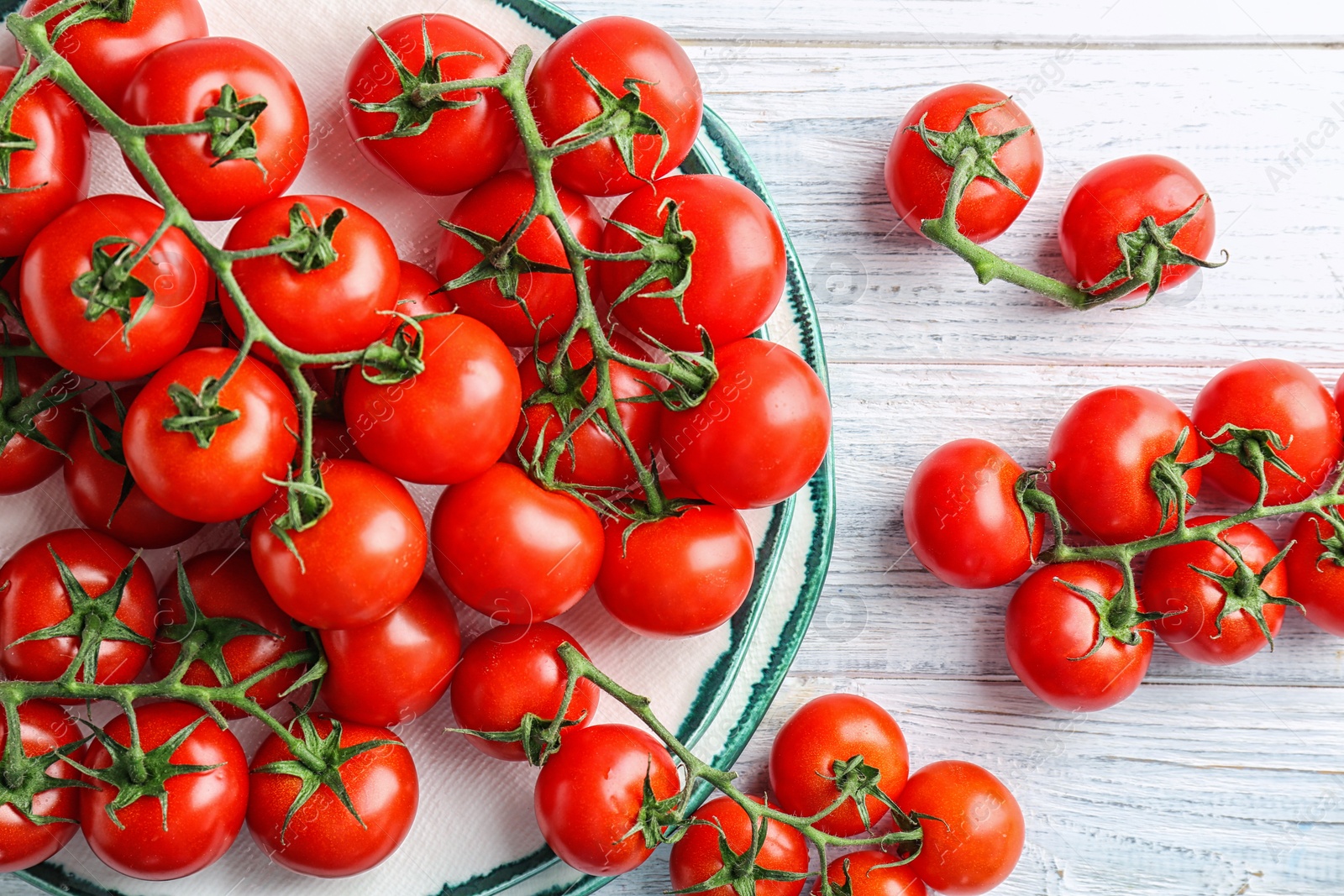 Photo of Flat lay composition with ripe tomatoes on wooden background