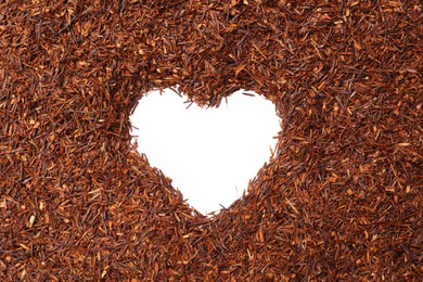 Photo of Heart shaped frame made of rooibos tea on white background, top view