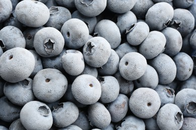 Photo of Tasty frozen blueberries as background, top view
