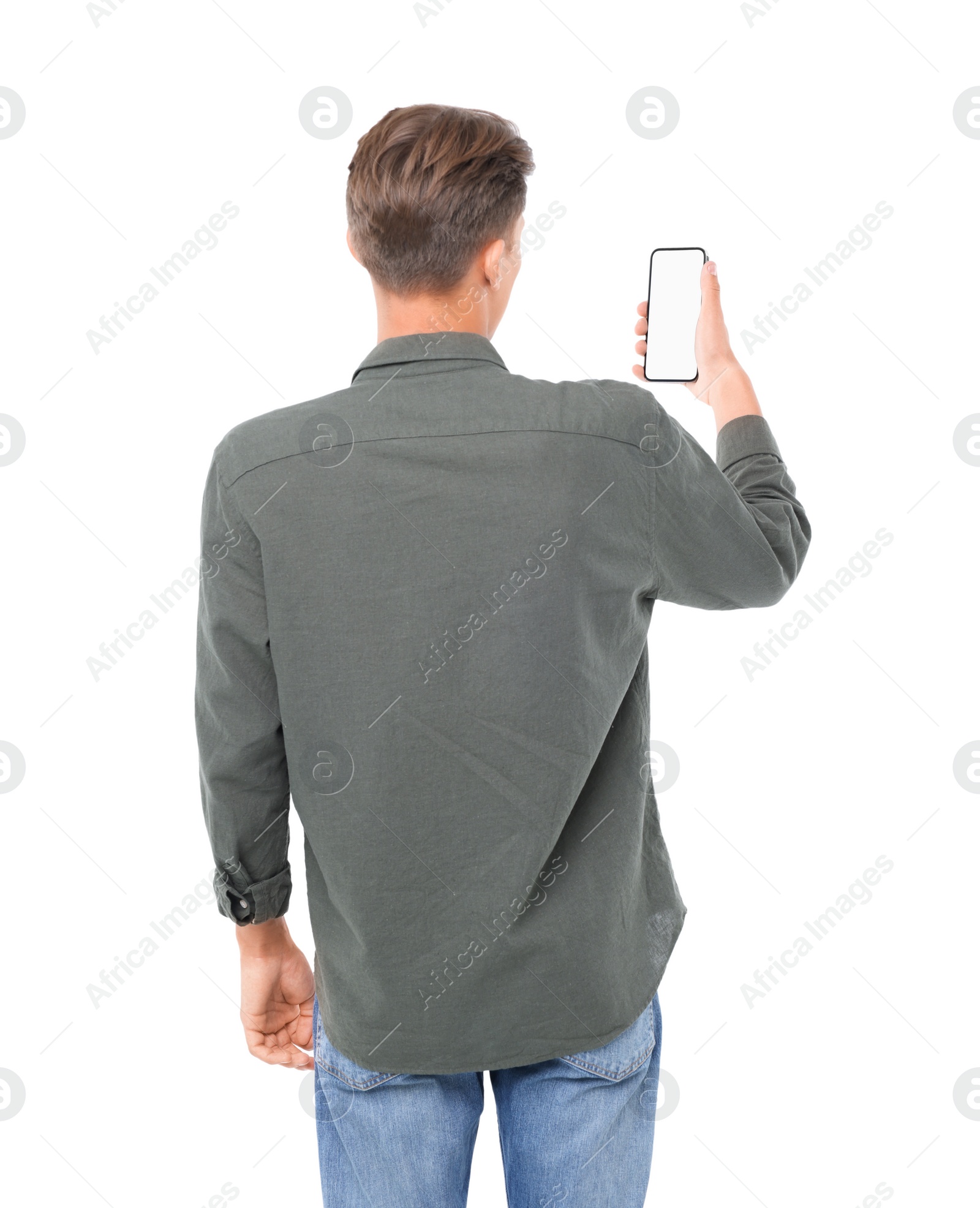 Photo of Man holding phone with blank screen on white background, back view. Mockup for design