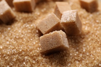 Photo of Different types of brown sugar as background, closeup