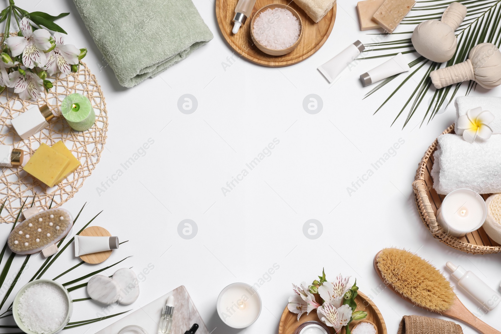 Photo of Frame of spa essentials on white background, flat lay. Space for text
