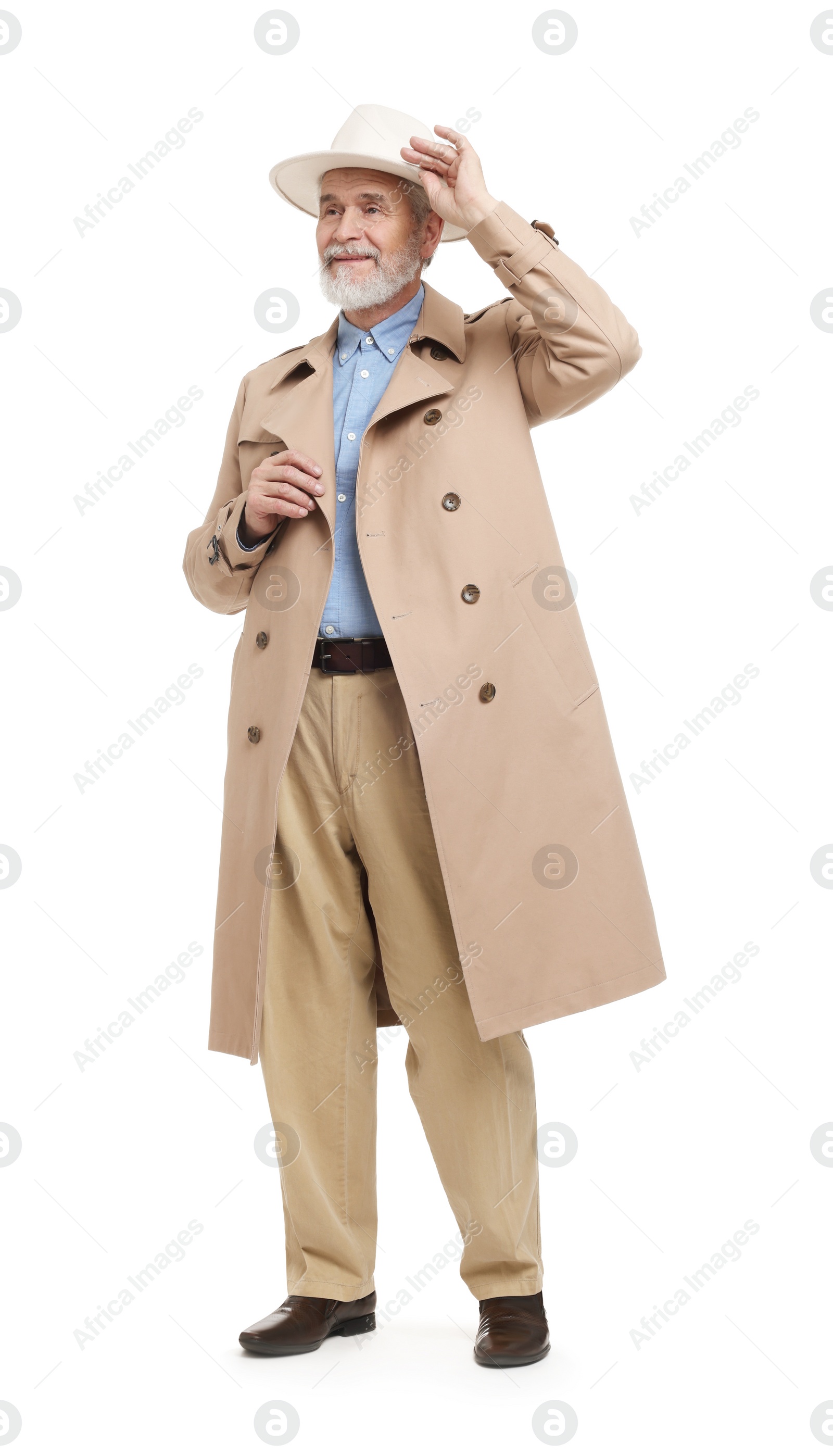 Photo of Senior man in hat and coat on white background