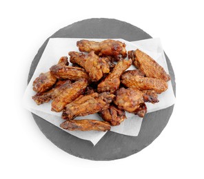 Photo of Slate board with delicious chicken wings isolated on white, top view