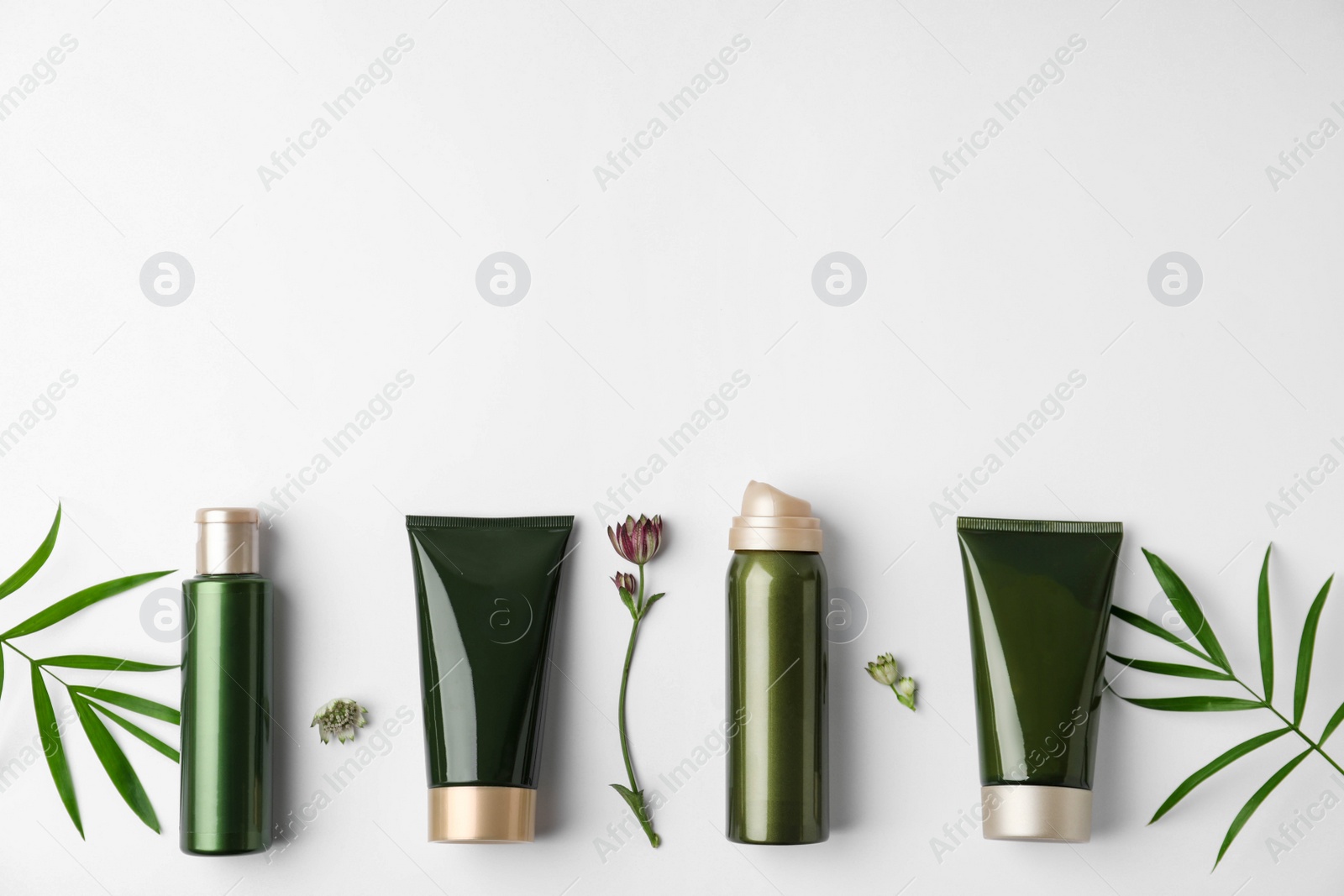 Photo of Flat lay composition with cosmetic products on white background. Space for text