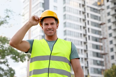 Professional engineer in safety equipment at construction site