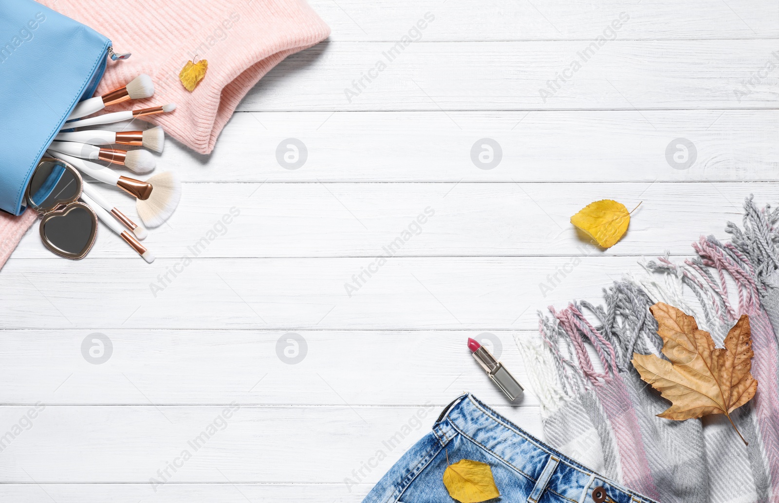 Photo of Flat lay composition with stylish clothes and accessories on white wooden background, space for text