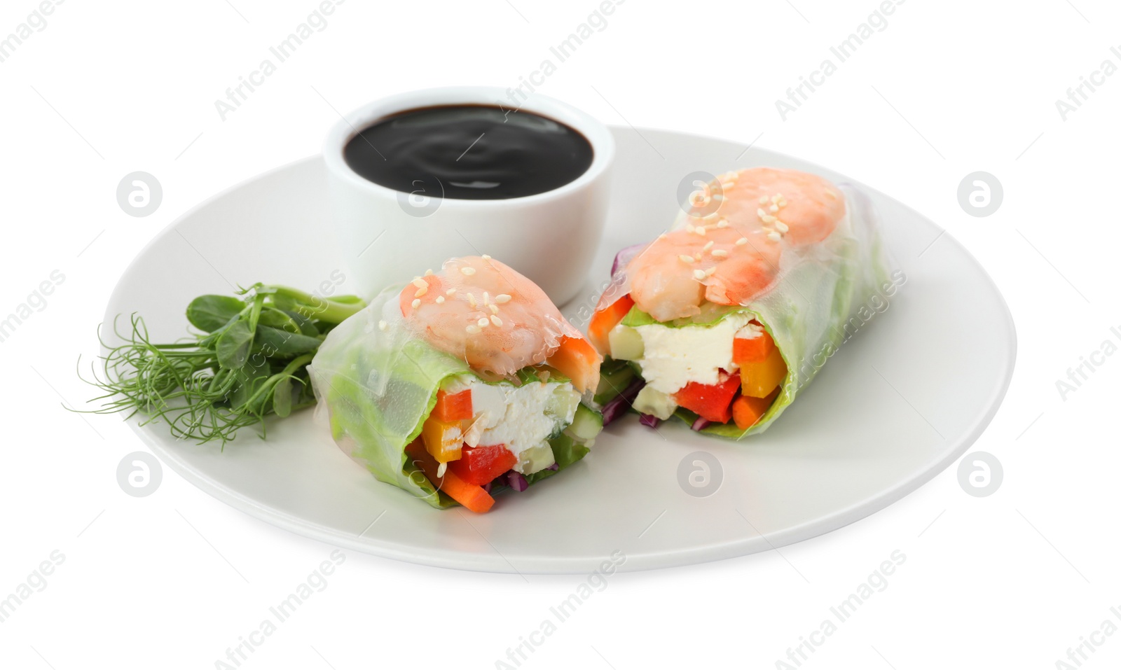 Photo of Plate with delicious roll wrapped in rice paper and teriyaki sauce on white background