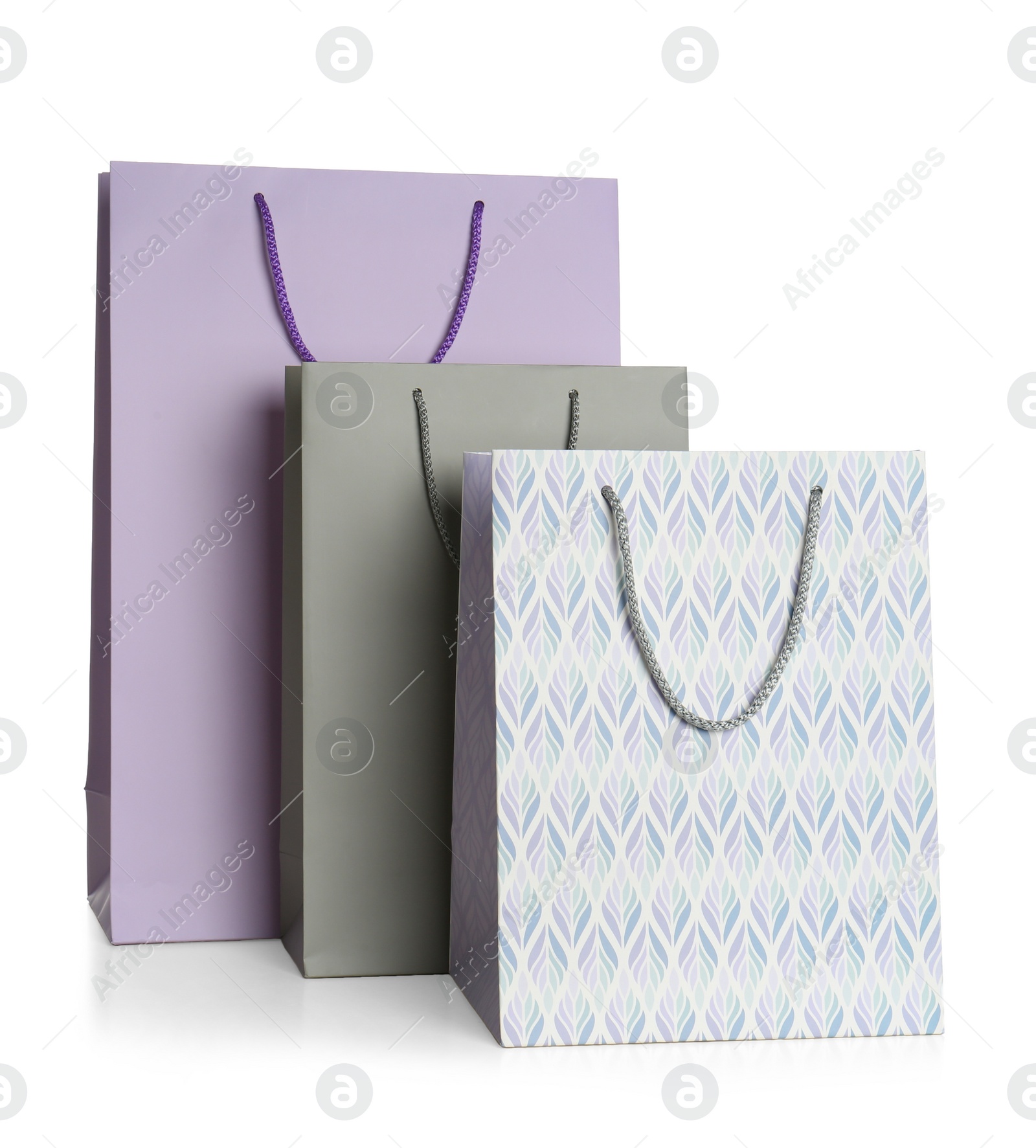 Photo of Stylish gift paper bags isolated on white