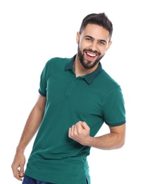 Happy young man celebrating victory on white background