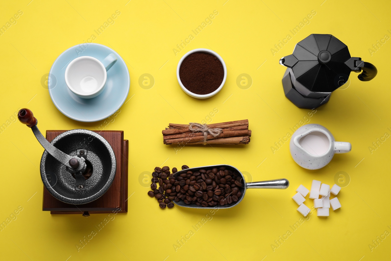 Photo of Flat lay composition with vintage manual grinder and geyser coffee maker on yellow background