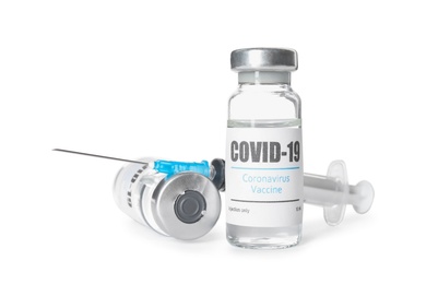 Photo of Vials with vaccine against coronavirus and syringe on white background