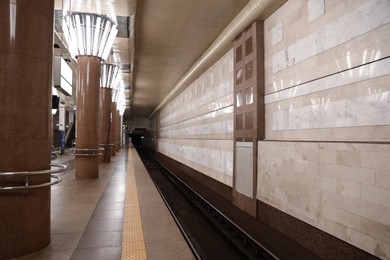 Photo of Empty subway station with beautiful columns. Public transport