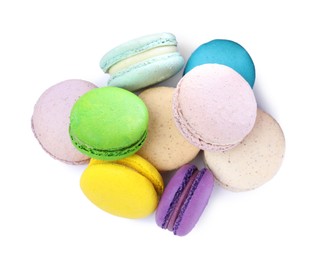 Photo of Different delicious colorful macarons on white background, top view