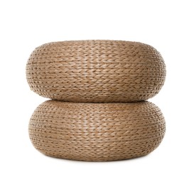 Photo of Two stylish wicker poufs on white background