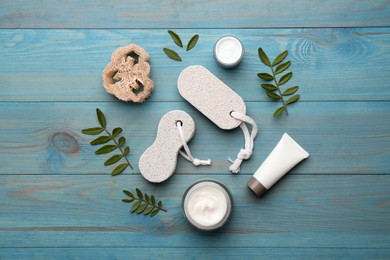 Photo of Flat lay composition with pumice stones on turquoise wooden background