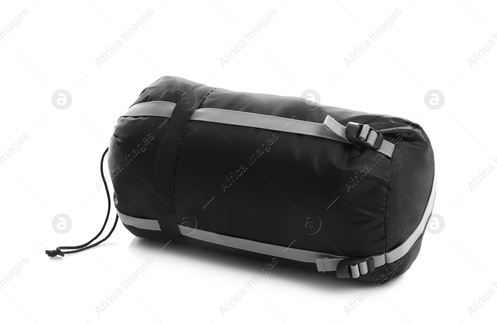 Photo of Sleeping bag in case on white background. Camping equipment