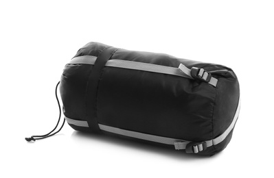 Photo of Sleeping bag in case on white background. Camping equipment