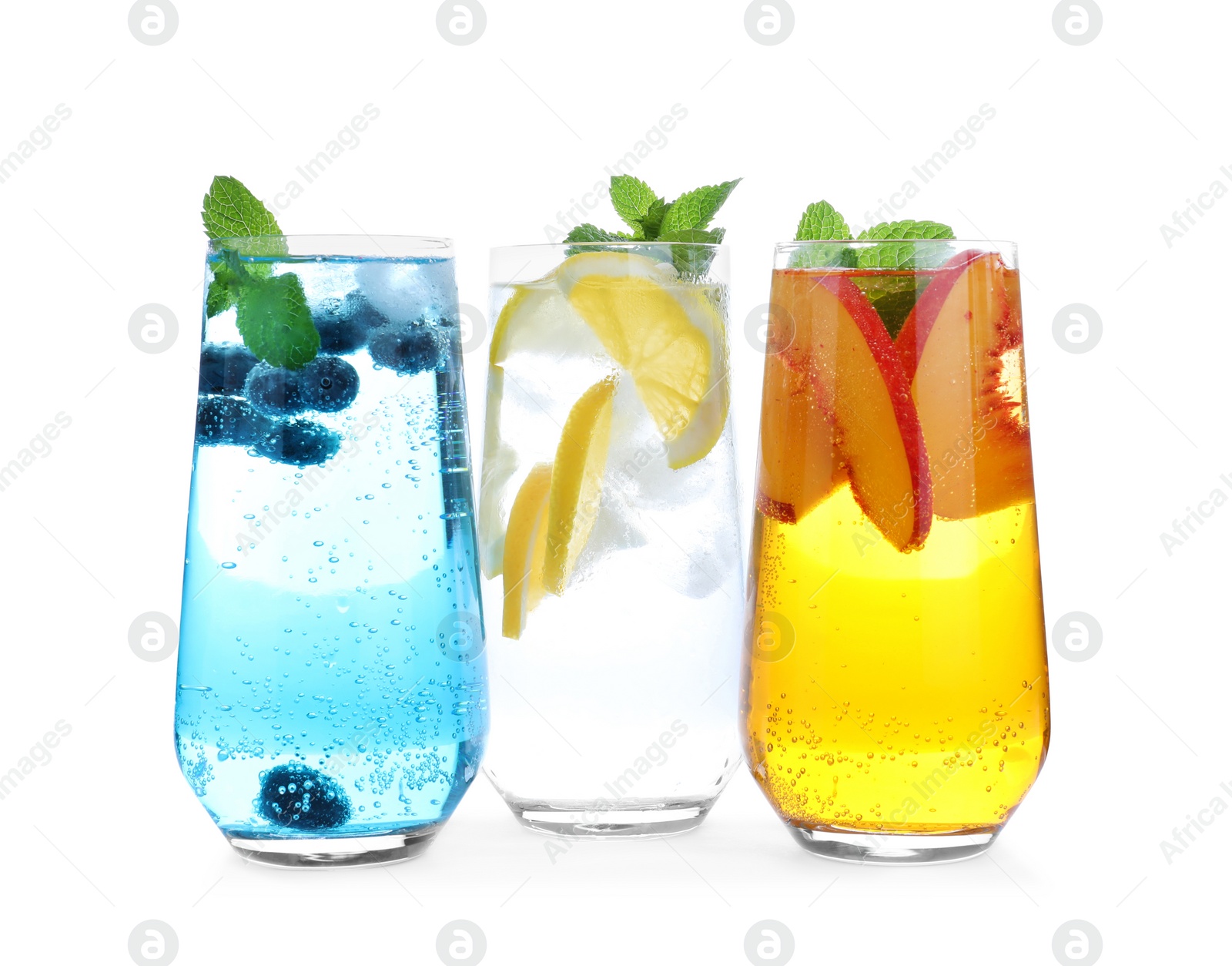 Photo of Different delicious lemonades made with soda water on white background