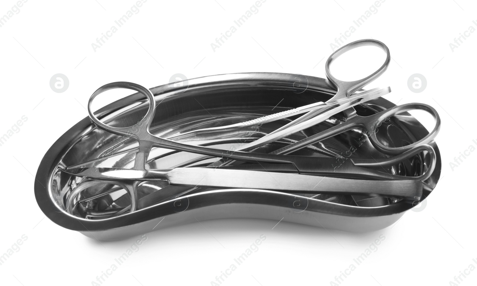 Photo of Surgical instruments in kidney dish on white background