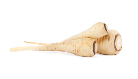 Photo of Tasty fresh ripe parsnips on white background