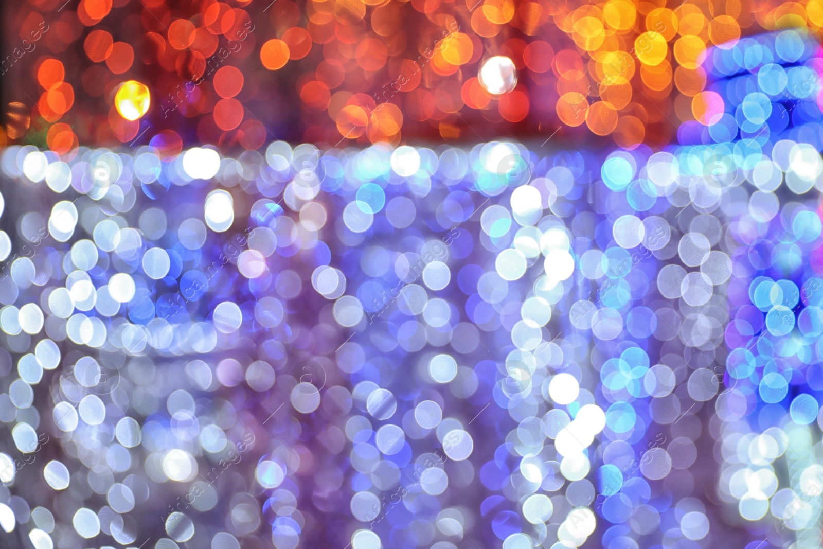 Photo of Blurred shiny lights as background. Bokeh effect