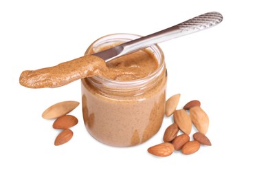 Tasty nut paste in jar, knife and almonds isolated on white